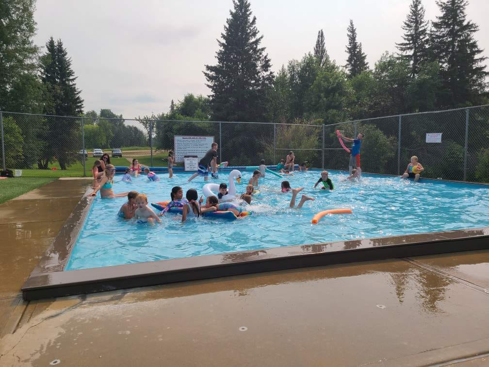 Cooling off in the park's wading pool on a summer afternoon